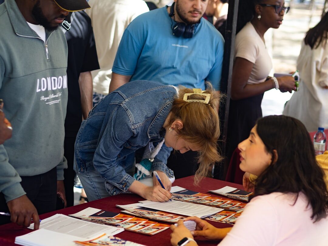author signing books at event