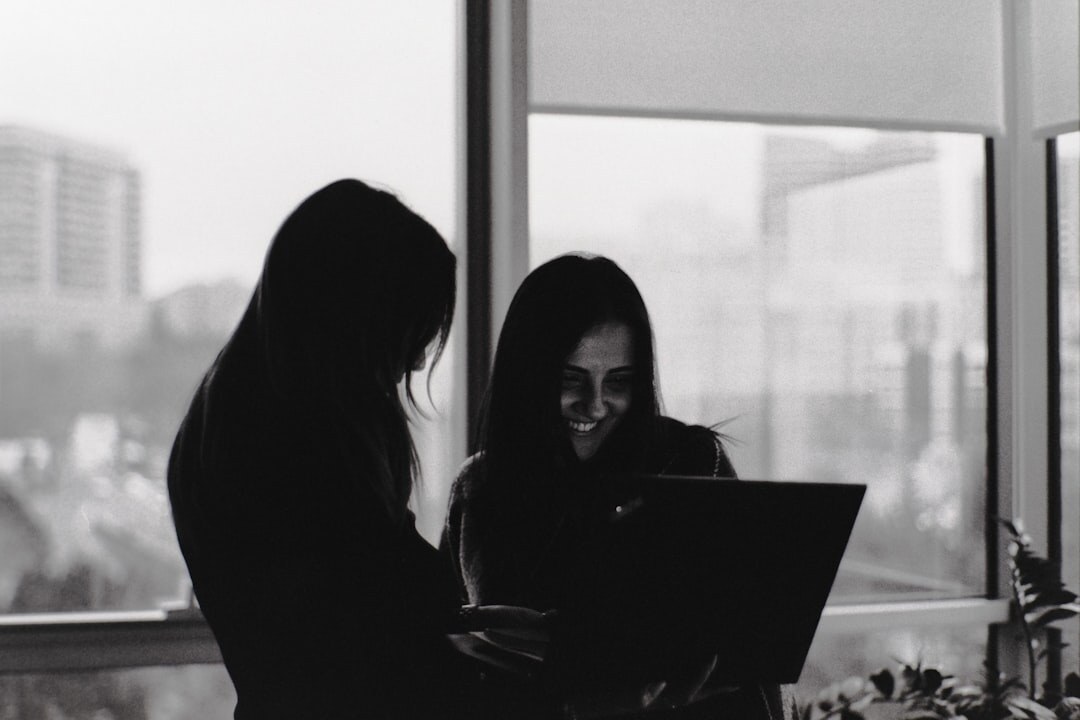 team collaborating on laptop